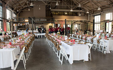 Horticulture Building set up for a wedding with tables and chairs