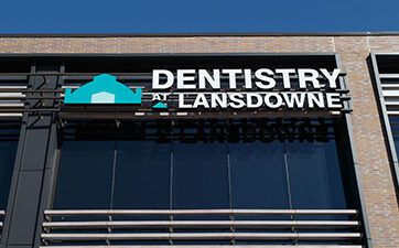 Image showing the the Dentistry at Lansdowne logo outside on the side of thebuilding at TD Place
