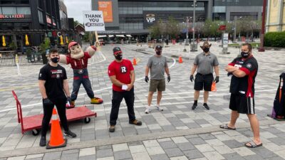 Image of REDBLACKS players, staff and Big Joe posing for a socially distant photo